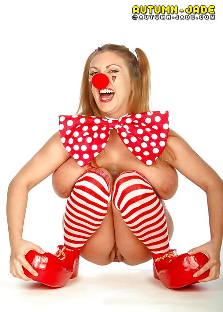 Seductive american porn star Autumn Jade showing big tits and hairy pussy 